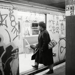 A passenger boards a subway car painted with graffiti in 1984